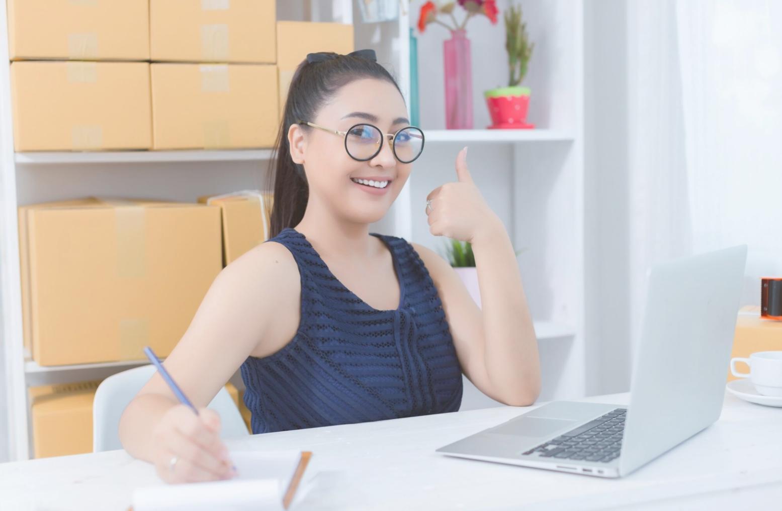 Financial planning workspace showing budget analysis documents and laptop